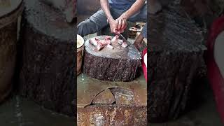 In A Fish Market Cutting Fish 