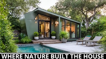 Dit mosgroene kleine huis voelt levendig aan in zijn tuinparadijs