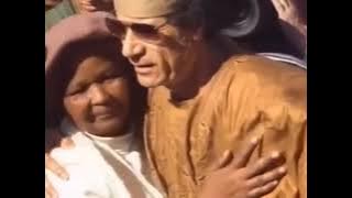 King muammar al Gaddafi with his people walks . #muammar al gaddafi #libya #arableague