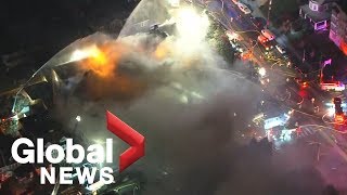 Over 100 firefighters battle massive five-alarm fire at apartment building in Philadelphia