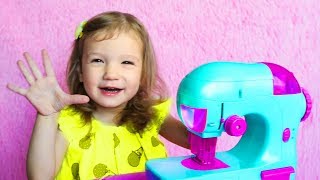 Kids And Mommy Playing With Toy Sewing Machine