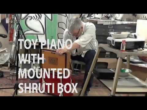 TOY PIANO WITH MOUNTED SHRUTI BOX