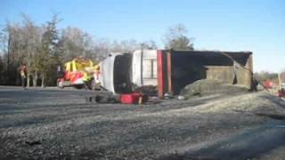 Dump truck full of gravel tips over on U.S. 80