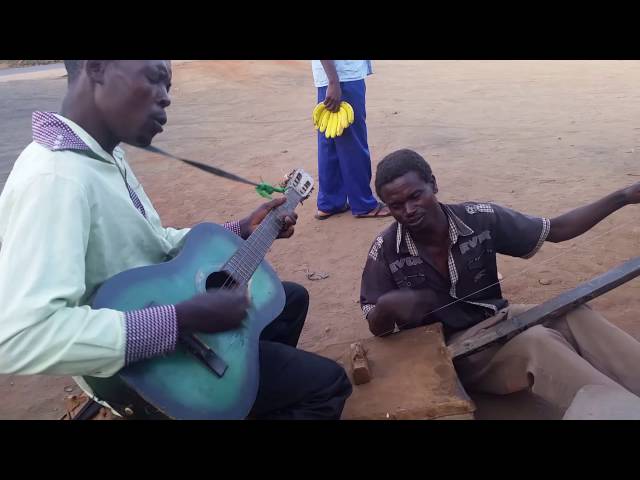 Malawi street musicians, MADALISO GROUP, sing a Chewa gospel song class=