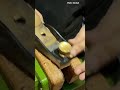 plane to shave and level the surface of a small wooden block