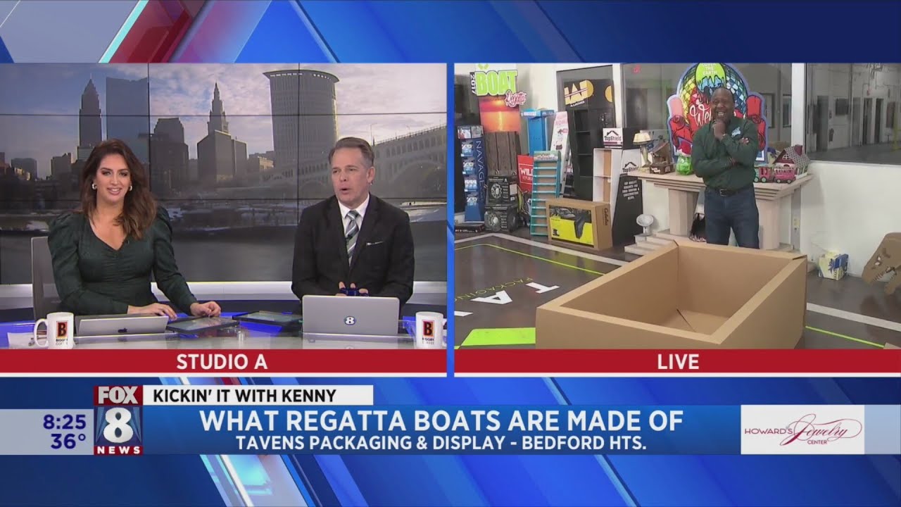 Kenny checks out boat construction before he sets sail in Lakewood H.S. Regatta