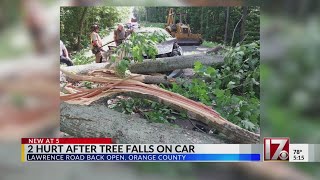 2 hurt after tree falls on car; Orange Co. road reopens