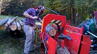 PTO driven portable firewood processor, auto splitting ram, power infeed and outfeed, max log 14"