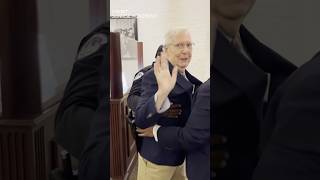 Sen. Mitch McConnell falls on his way to shutdown vote in Capitol hallway.