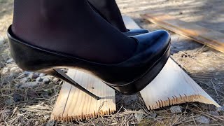 High heels bending, one heel standing, high heels crush, sinking heels into wooden planks (# 1024)