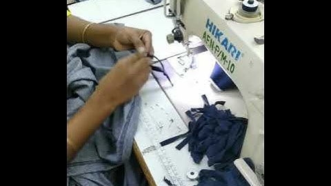 Twill tape attaching on side vent of polo shirt