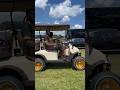 Golf kart on gold Dayton Wire wheels at the Rick Ross Carshow 4