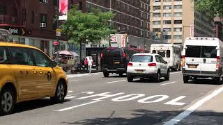 UNMARKED BLACK NYPD VAN RESPONDING ON 8TH AVENUE IN THE MIDTOWN AREA OF MANHATTAN IN NEW YORK CITY.