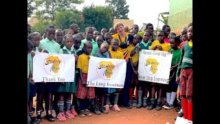 Peyton Thomas Executive Director Greets Students Of The Uganda Youth Aid School, Kampala, Uganda.