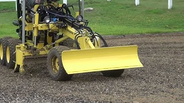 Laser-Grader 106-P equipped with Grade Control Package and a Harley Rake Attachment