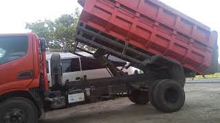 Cara Mengoperasikan Naik Turun Bak Dump Truk