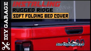 How To Install a Rugged Ridge Soft Folding Bed Cover in a Jeep Gladiator screenshot 1