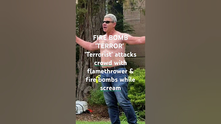 FIRE BOMB 'TERROR'   ‘Terrorist’ attacks crowd with flamethrower & fire bombs while scream