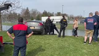 Car ends up in retention pond at Walmart in Batavia