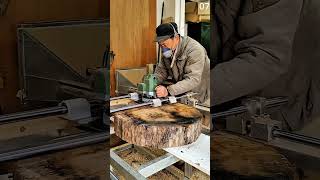 Flattening round wooden slab using guided router sled system