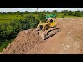 Land Filling Construction On Rice Filds Two Komatsu Dozer Pushing Dirt, Dump Truck Unloading Dirt