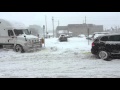 Volkswagen Touareg TDI pulls transport truck out of snow bank