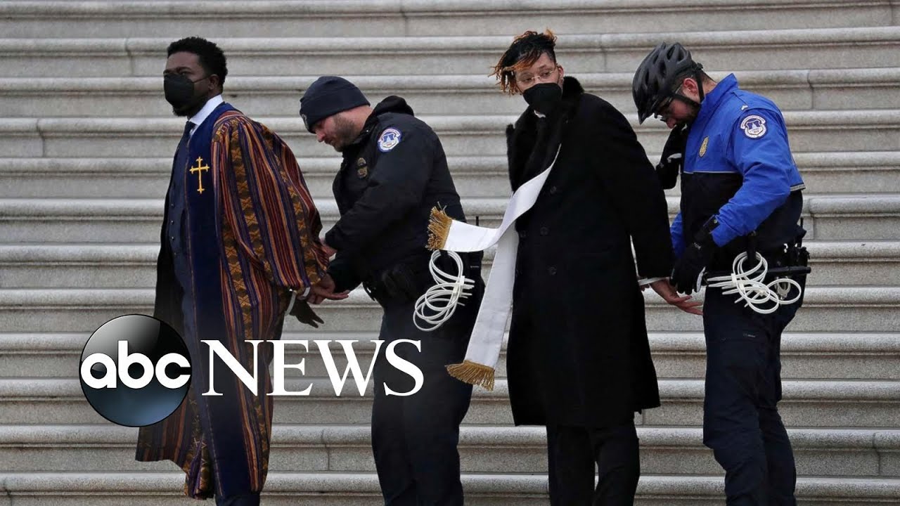 Voting rights protest, Timkat and an oil spill: World in Photos, Jan. 19