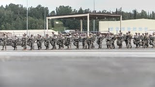 US Army Paratroopers Jump Out From Royal Australian Air Force C-130 Hercules