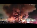 Multiple vehicles and vegetation ablaze at local tow yard, Sacramento