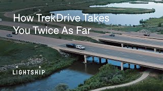 How far can a truck tow an 8,000-pound trailer before needing to refuel or recharge?