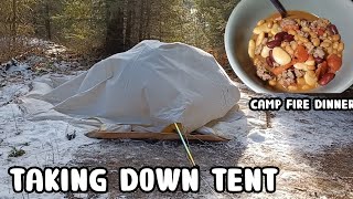 Taking down the tent. One last campfire dinner.