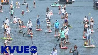 Paddleboarders float miles for cancer therapy | KVUE