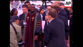 The white hearse carrying Anna Nicole Smith's body arrives at a Bahamas church for a 'very pink' and