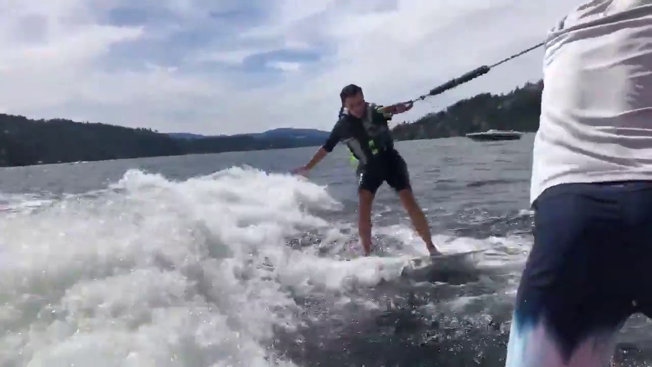 Kim Kardashian uses her balance to successfully get up on a surf board for the first time ever