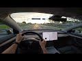 Test driving Tesla model 3 standard range+ from Riga to Jurmala. Latvia. Cloudy