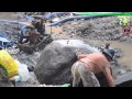 Old Man Breaking The Big Rocks By Hand Chisels