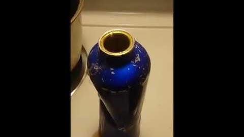 Repairing a dented metal water bottle.