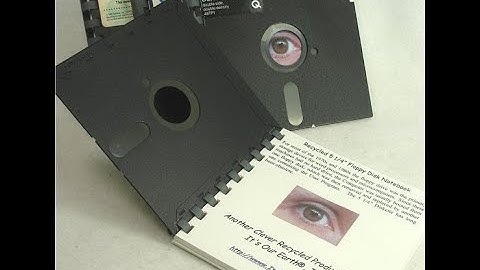 How to remove a floppy disc from its protective cover.