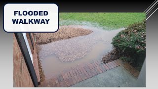 Replacing a sunken and flooded walkway with correct slope