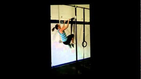 Jennifer getting a kipping pullup.