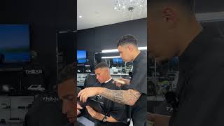 Barber pretends to blend his client's hair more to keep him happy!