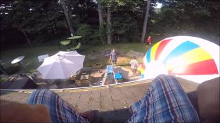 Daredevil jumps from roof onto balloon.