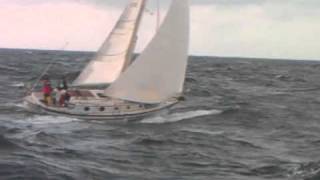 Mono hull sailing next to Lagoon 420 Catamaran in the 2010 Harvest Moon Regatta