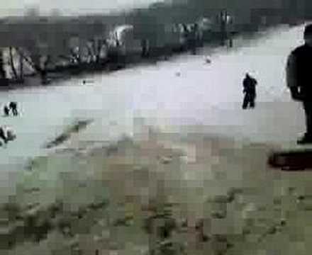 Two idiots film themselves as they take a jump on a sledge. as they slowly freeze to death