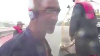 News Reporter Comes To A Truck Driver Aide During Hurricane Harvey