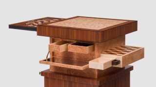 Craig Thibodeau - CT Fine Furniture - Automaton Table An Art Deco style table with automated movement and a variety of secret drawers and hidden details. There is also a circular