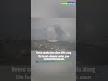 Dense smoke rises above hills along the Israel–Lebanon border, seen from northern Israel.
