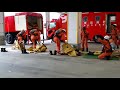 化学防護服の着装準備,Firefighters put on chemical protection suits