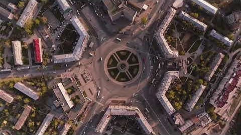 Traffic circle. Aerial view of traffic at the intersection of a circle. drone spin around crossroads