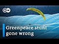 Greenpeace activist crashes Euro game in paraglider | DW News